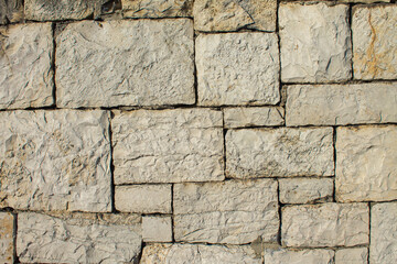 limestone blocks stacked into the wall