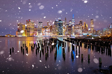 Fototapeta na wymiar New York City downtown waterfront evening snow view, famous skyline