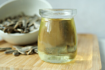 sunflower oil seed and oil in a container on table 