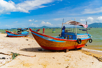 Naklejka na ściany i meble Fishing boats on the shore. Vietnam, Doclet, near Nha Trang. Fishing village. 