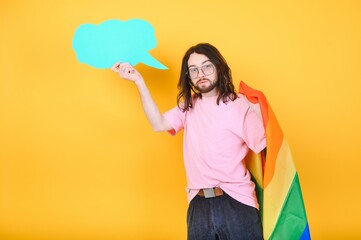 Portrait of a gay man on a colored background. Gender equality. The concept of the LGBT community. Equality.