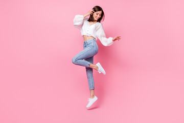 Full length photo of cute lady skinny figure look empty space footwear satisfied trendy purchase outfit isolated on pink color background
