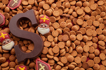 Dutch holiday Sinterklaas background with traditional sweets and chocolate letter.