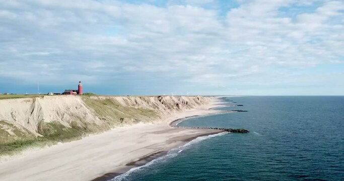 
Flight at the North Sea towards the cliff and beach below the famous lighthouse Bovbjerg Fyr, Jutland, Denmark, high quality video