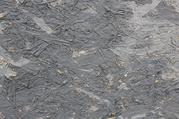 Texture of plywood with a peeled coat of paint.