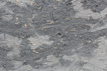 Texture of plywood with a peeled coat of paint.