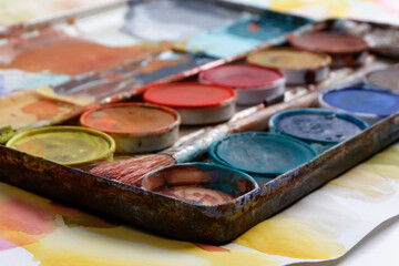 vintage paintbox with old colors inside rusty metal box
