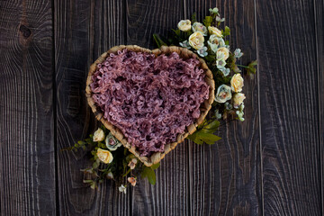 Newborn digital backdrop with heart shaped basket and handmade flowers on wooden background. Newborn background. Top view. Flat lay.