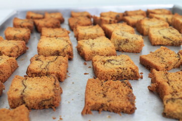 a bunch of slices dried chocolate banana sponge in a baking dish on the table