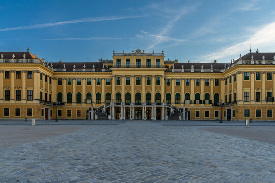 view of the front of the historic Schoenbrunn Palace in Vienna in warm evening light