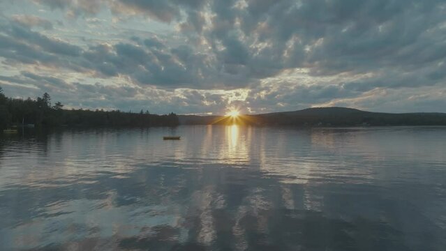 Establishing aerial sunset seen from shoreline of Lake Hebron