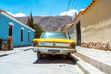 retro car parked at tilcara town, argentina
