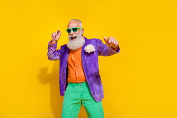 Photo portrait of handsome grandparent dancing party maker superstar dressed stylish colorful clothes isolated on yellow color background