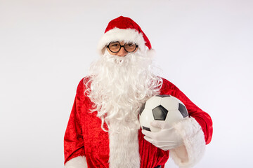 Santa Claus with glasses holding a World Cup soccer ball as a gift for all children, with a white background where his red suit and white beard stand out