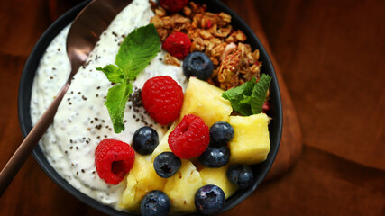 Breakfast bowl with chia yogurt, berries and fruits. Healthy snack or dessert.