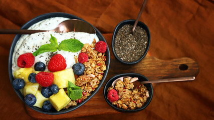 Breakfast bowl with chia yogurt, berries and fruits. Healthy snack or dessert.