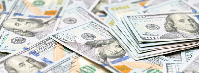 Dollars background. Much American money. Pile of new design US dollar bills. Currency, cash dollars. Finance, payment, trade, financial transactions concepts. Banner