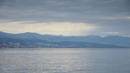 View of the Kvarner Bay with city of Rijeka and mountains in the background.
