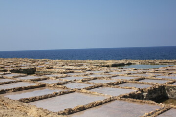 Salt pans by the sea
