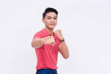 A man shows his readiness by throwing a punch while taking a boxing stance. Concept of reliability...
