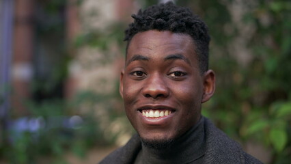 Happy satisfied black African portrait face close-up smile