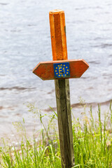 European long distance paths sign by a lake