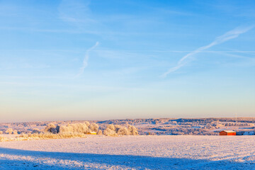 Winter countryside landscape with snow and frost
