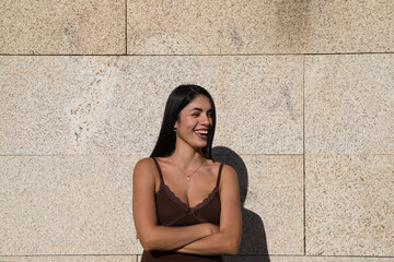 Young beautiful woman making different expressions of surprise, anger or happiness and sadness on a gray background. Concept expressions and gestures.