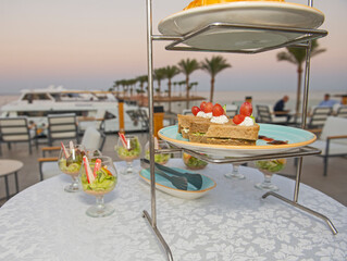 Selction of salads and sandwiches at an outdoor  buffet