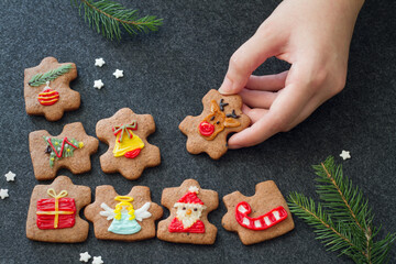 Christmas homemade cookies in shape of puzzle decorated with christmas motifs, elements to form whole christmas, concept