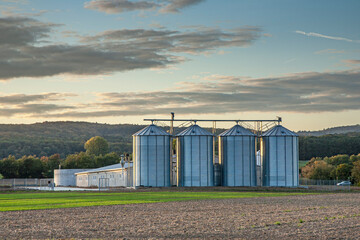 Fototapeta na wymiar agricultural silos in sunset with beautiful sky