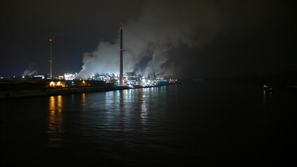 Fototapeta na wymiar Rine River at night Industry Dark Worms Germany
