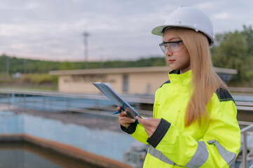 Environmental engineers work at wastewater treatment plants,Water supply engineering working at Water recycling plant for reuse