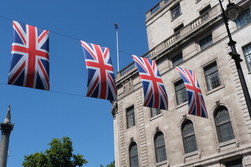 British flags hanging on the streets of London. Union jack flag triangular outside decoration.