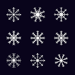 Set hand drawn white snowflakes on black background for ornaments, icons, or decoration. Winter wallpaper. Flat vector design