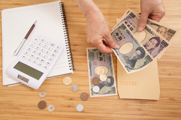 Fototapeta na wymiar 家計やお金の計算のイメージ