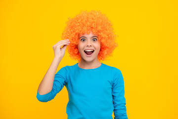 Girls birthday party. Funny kid in curly redhead wig. Time to have fun. Teen girl with orange hair,...