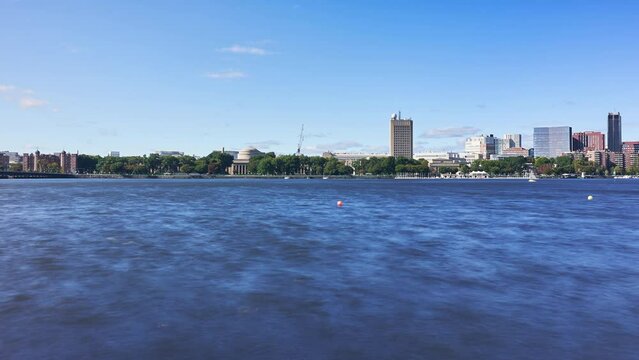 Looking across the Charles River at MIT's Maclaurin Building and Cambridge, Massachusetts - time lapse 
