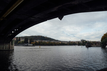 Riverside view of Prague Castle from under the bridge