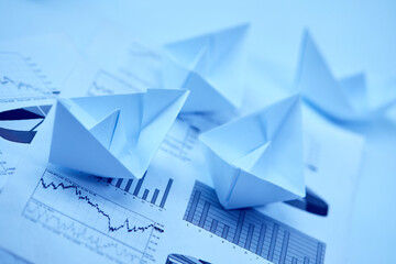 paper boats on the documents