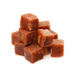 brown sugarcane cubes on white background.