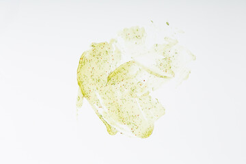 Pilling creamy green gel with particles. Concept of body care procedures