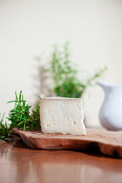 Piece of pecorino cheese. Top italian cheeses - Pecorino Cheese. Piece of italian pecorino cheese on wooden cutboard