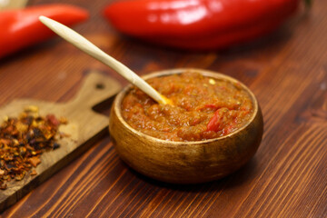 Balkan sauce ajvar and ingredients for its preparation. Serbian traditional food. Selective focus