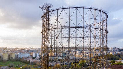 Aerial view at sunset of the Gasometer in the Ostiense district in Rome, Italy. The industrial...