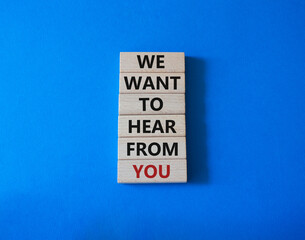 We want to hear from you symbol. Wooden blocks with words We want to hear from you. Beautiful blue background. Business and We want to hear from you. Copy space.
