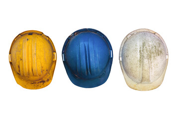 Three old and worn construction helmets