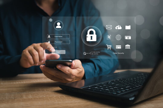 Cybersecurity concept padlock icon and password security of personal information on the secure internet access, Businessman use smartphone login to the internet system and laptop on the table