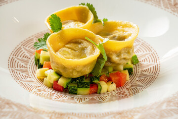 kreplach in chicken soup in restaurant