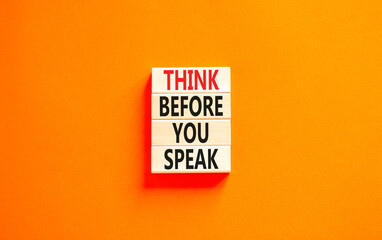 Think before you speak symbol. Concept words Think before you speak on wooden cubes. Beautiful orange table orange background. Business think before you speak concept. Copy space.